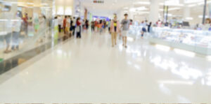 blurred image of people walking in mall