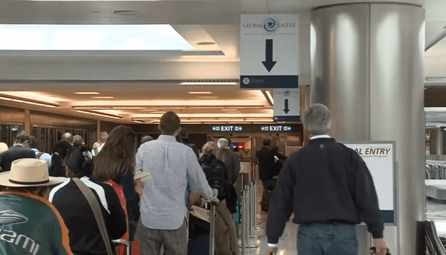 People waiting in line at global entry in an airport