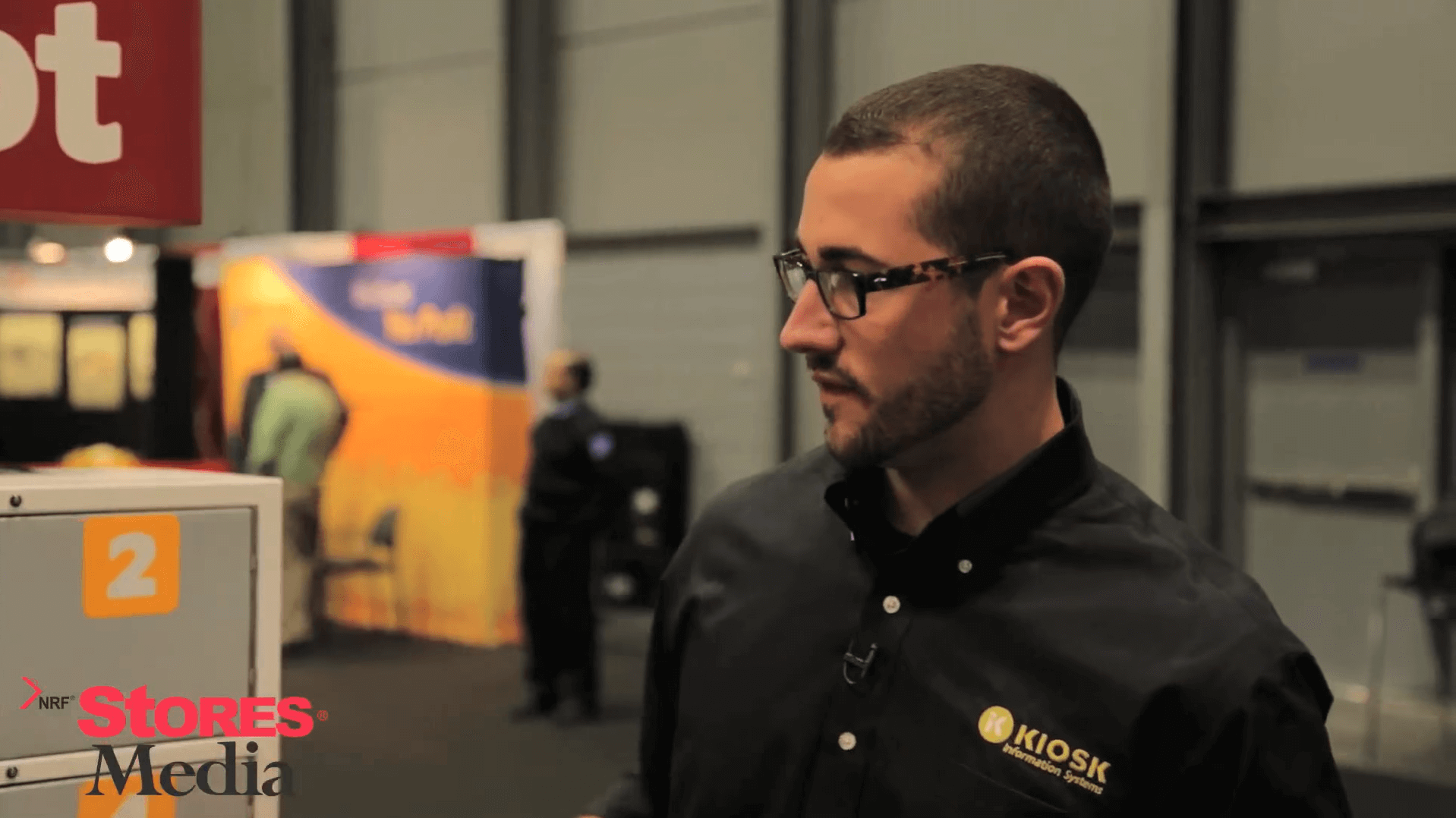 KIOSK employee showcasing kiosks at a tradeshow