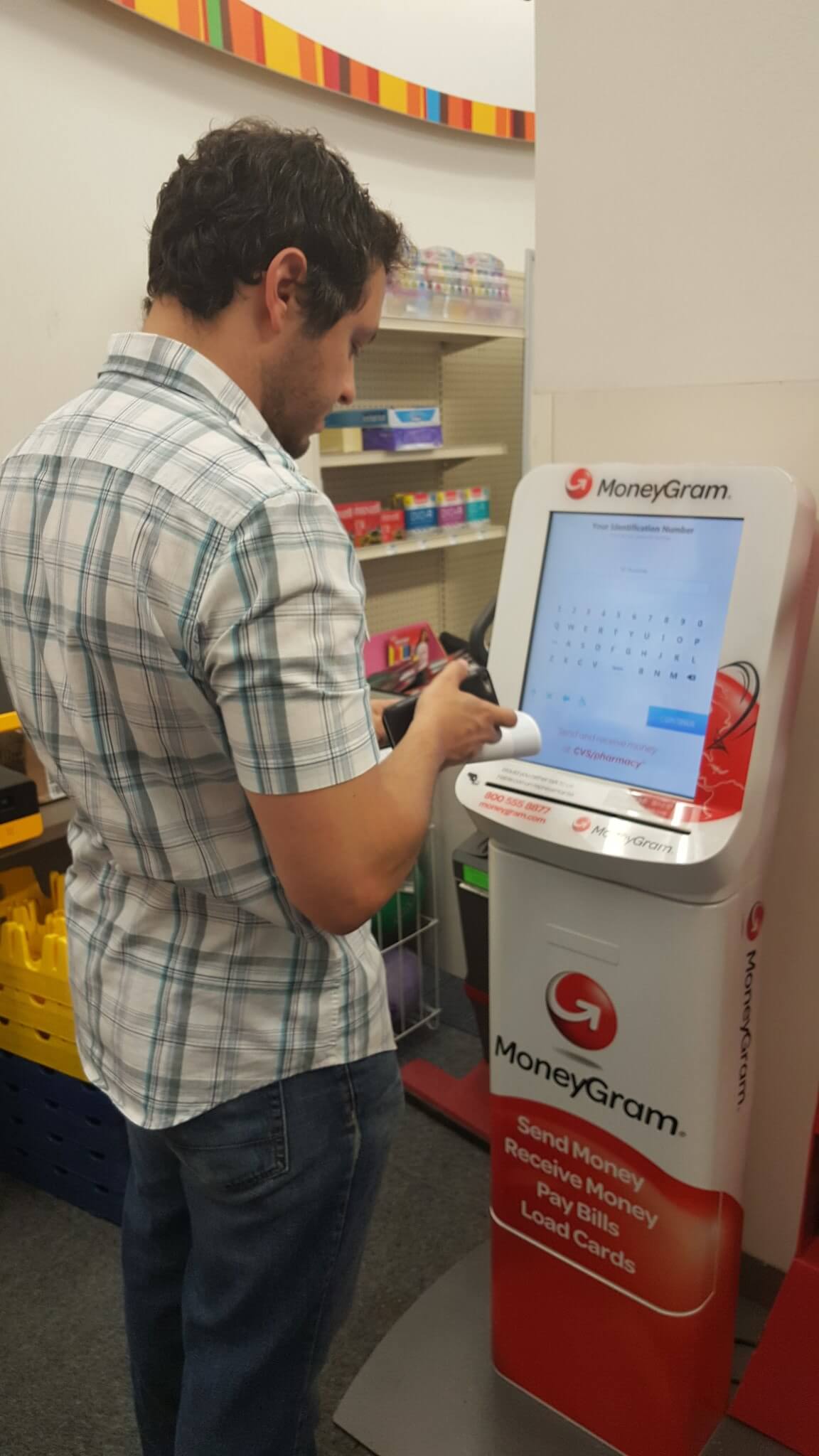 customer using moneygram kiosk