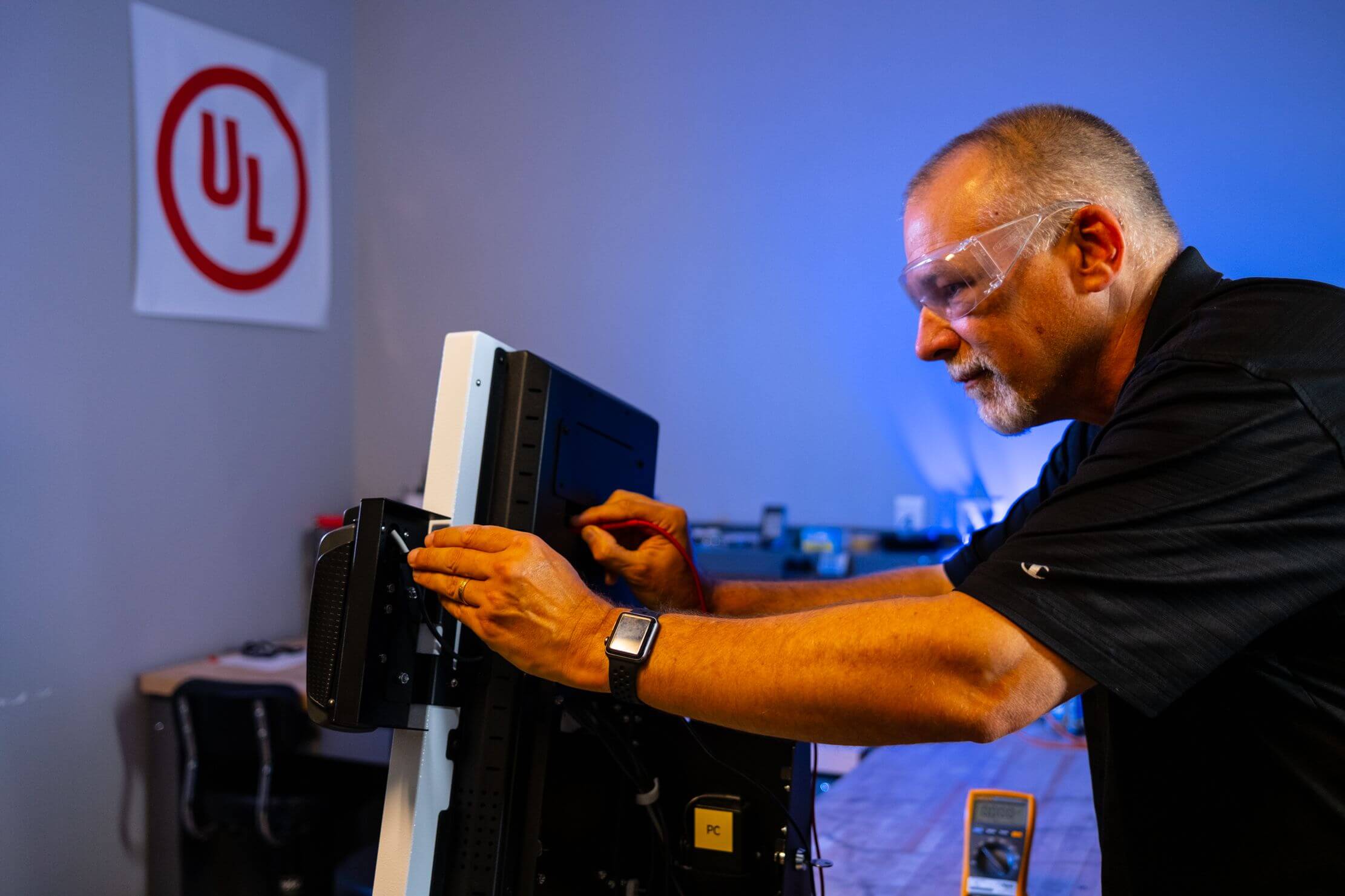 technician working on a kiosk