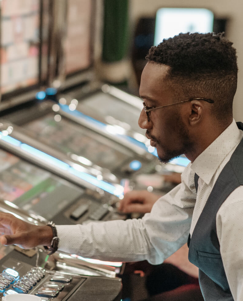 Man gambling at a kiosk