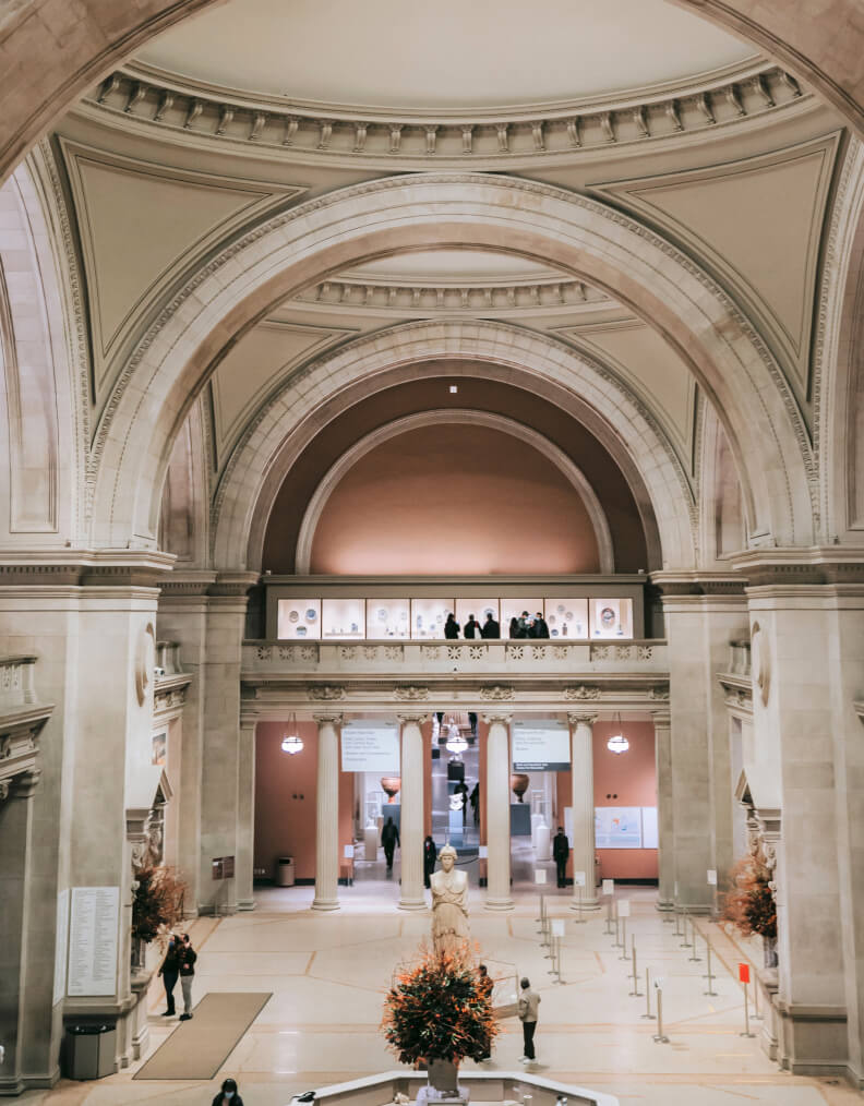 Inside of a government building, with high arched ceilings and marble floors