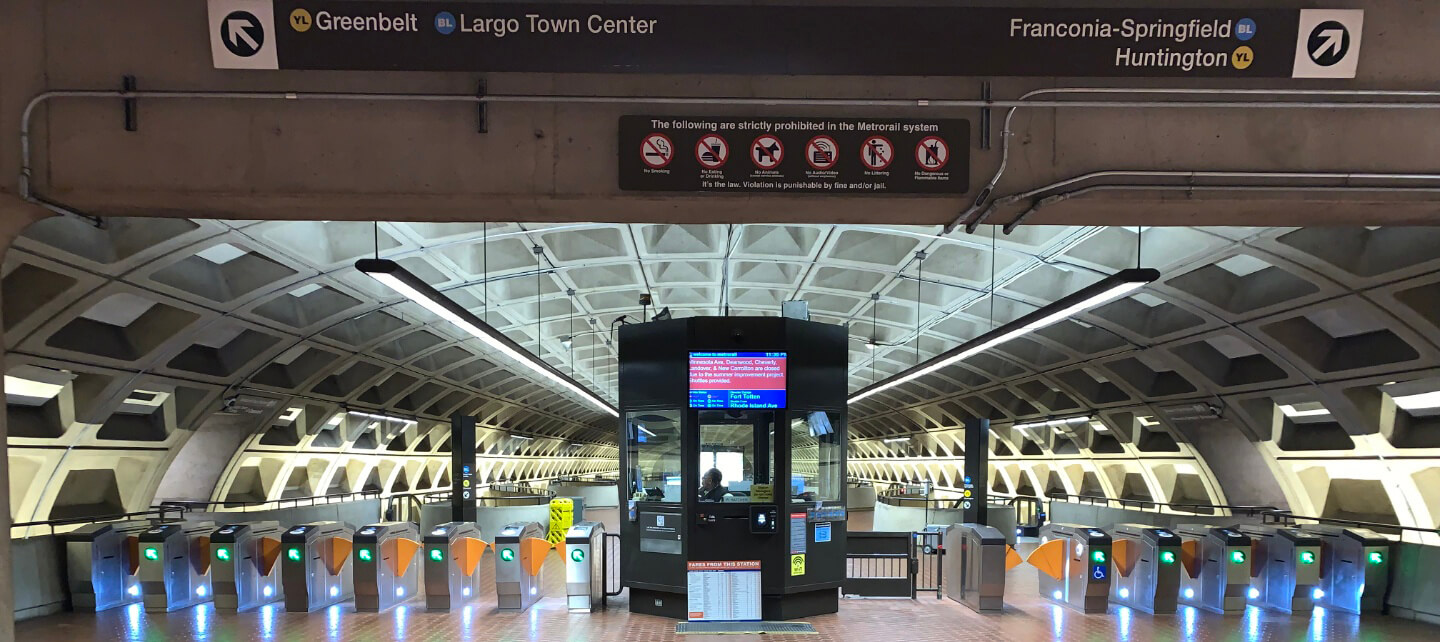 A row of entry gates in a metro station.