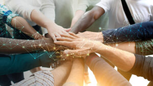 Diverse team joining their hands